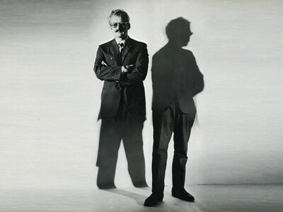 Full-body portrait of Hans Hillmann. Manipulated photograph in which the body and shadow are reversed.